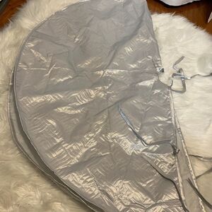 Silver quilted Christmas tree skirt. New, never used